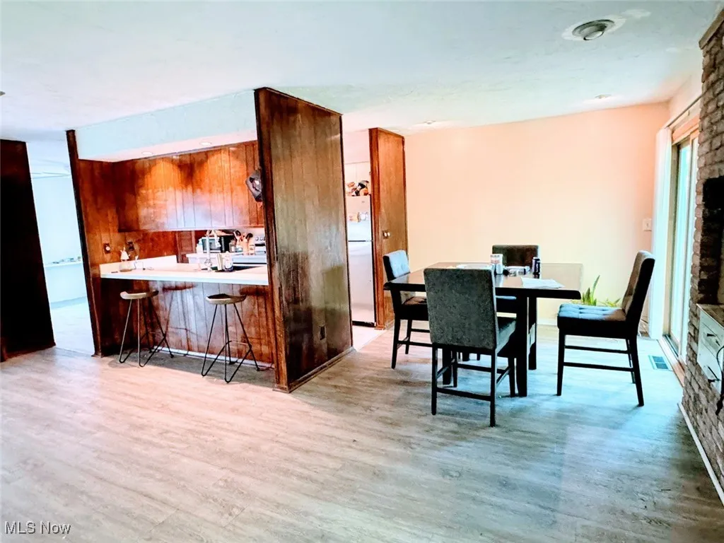 Dining area with wood finished floors