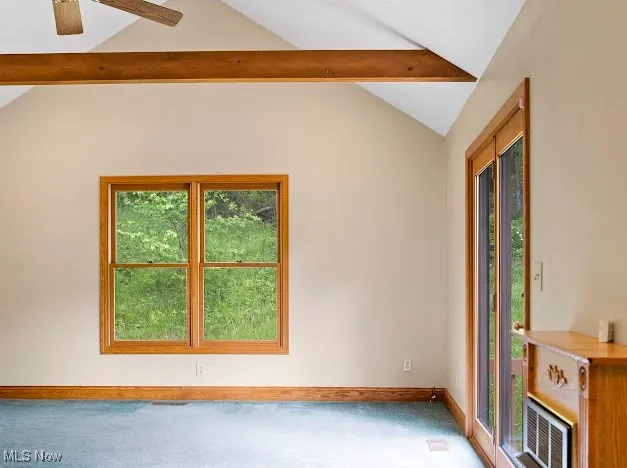 Empty room with carpet flooring, baseboards, and ceiling fan
