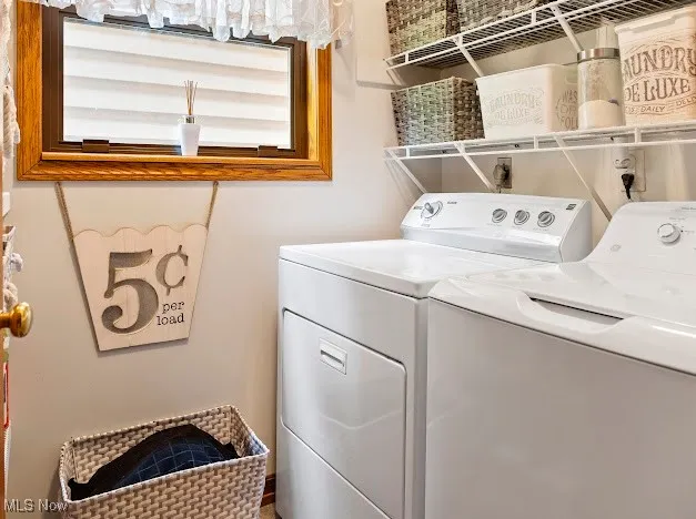 Washroom with washing machine and clothes dryer