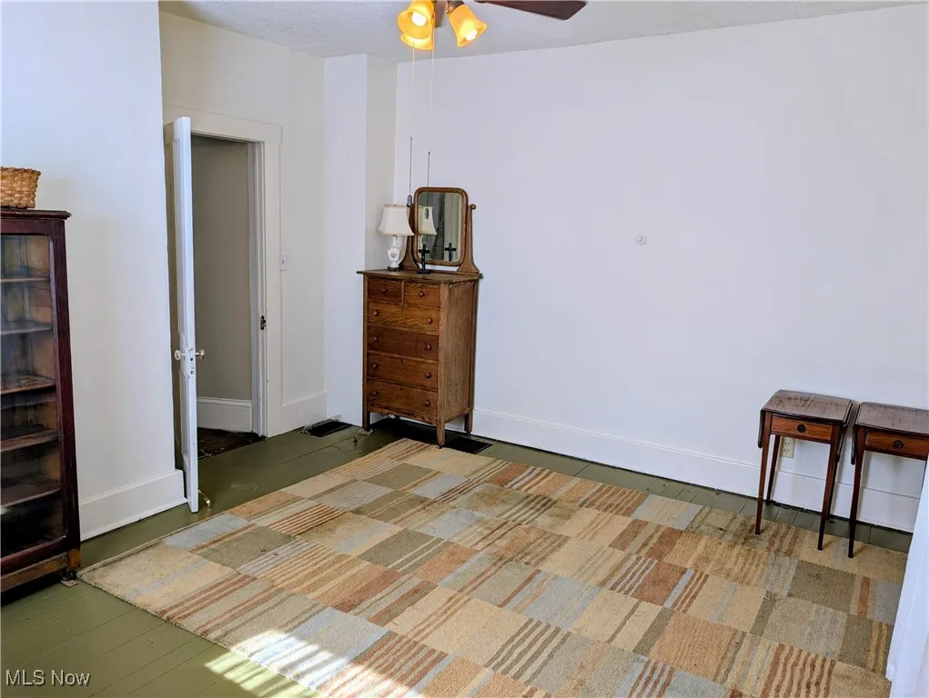 Bedroom with baseboards and ceiling fan
