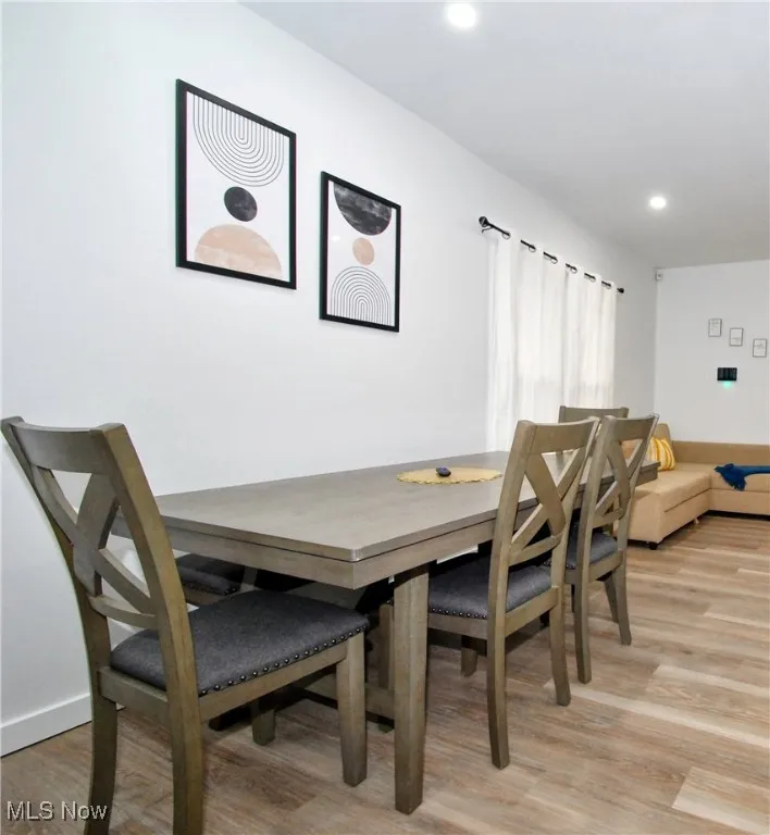Dining space featuring light wood-type flooring, recessed lighting, and baseboards