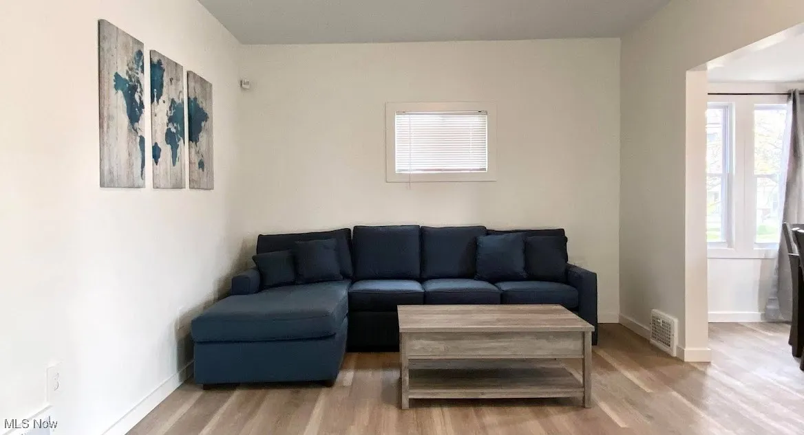 Living room featuring wood finished floors and baseboards