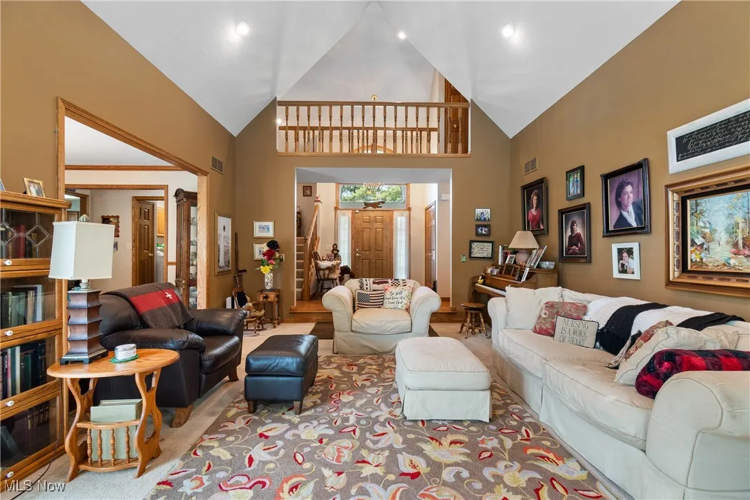 Living area with high vaulted ceiling