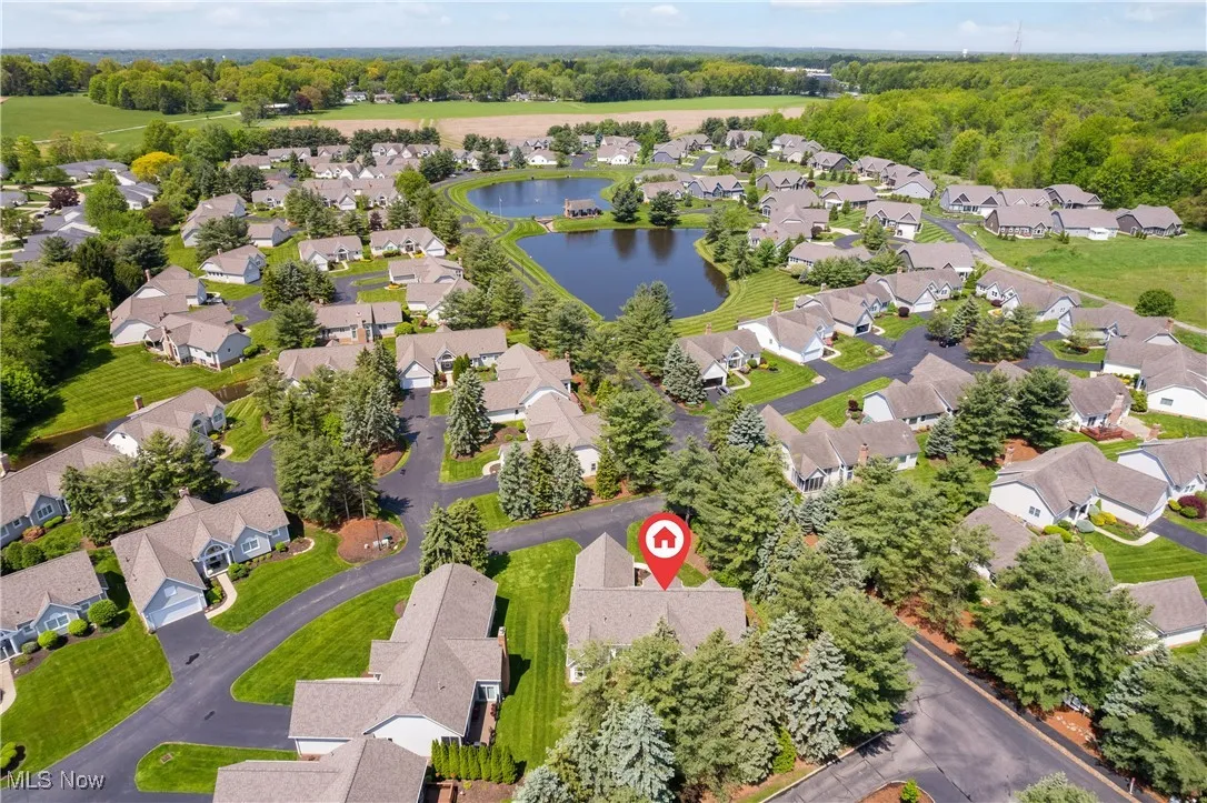 Aerial view of residential area featuring a large body of water
