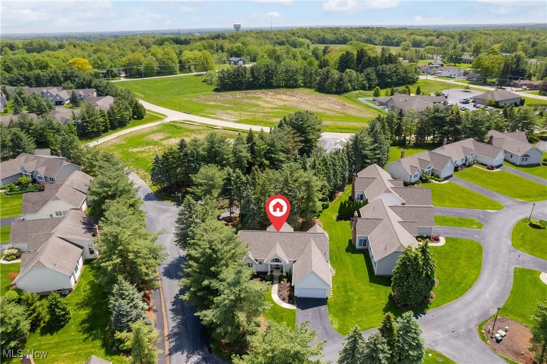Aerial view of residential area with a heavily wooded area