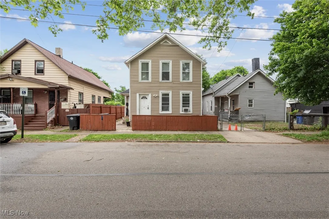 View of front of house with a gate, fence, and covered porch