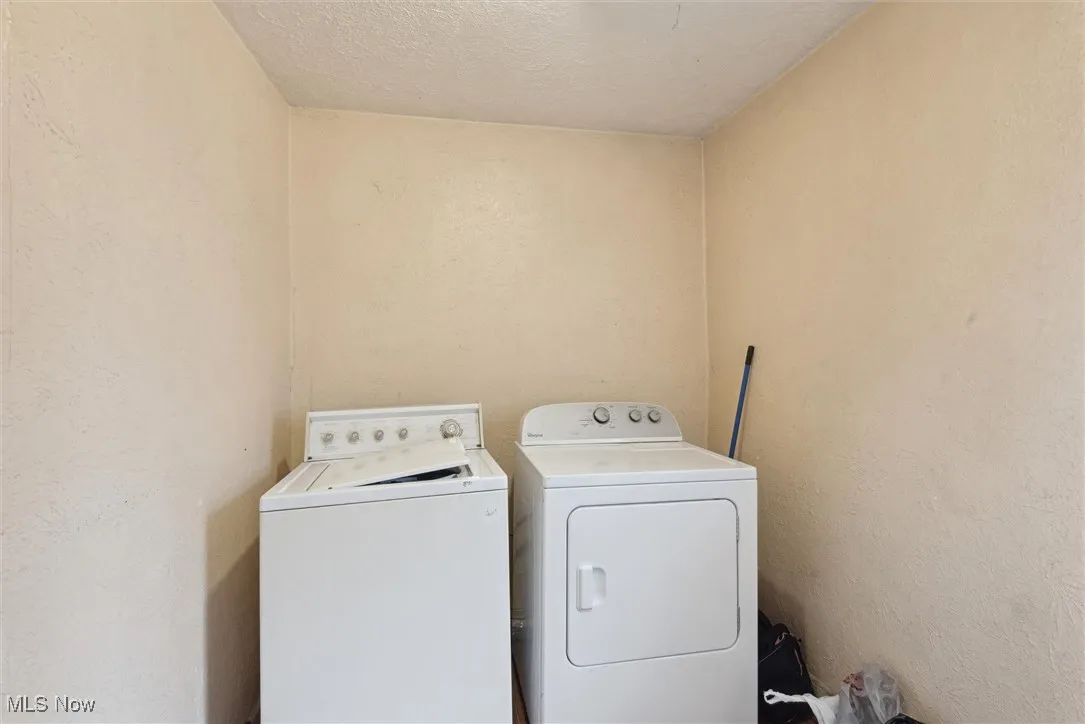 Clothes washing area featuring independent washer and dryer
