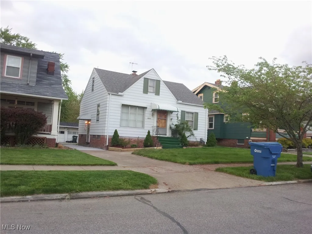 Bungalow-style house featuring a front yard and entry steps
