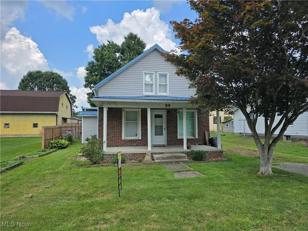 Bungalow-style house featuring covered porch, and a front lawn