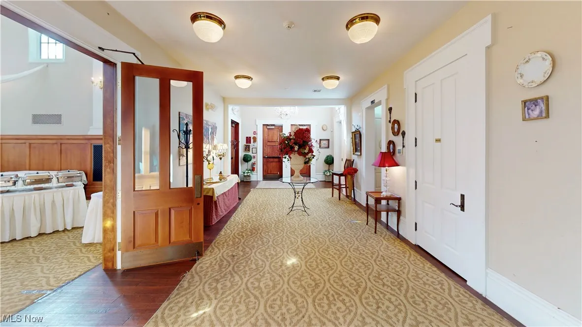 Corridor with dark wood-type flooring