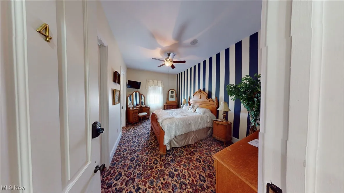 Bedroom with carpet flooring and ceiling fan