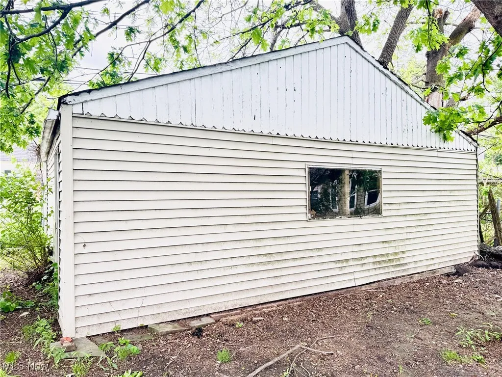 View of side of property with metal roof