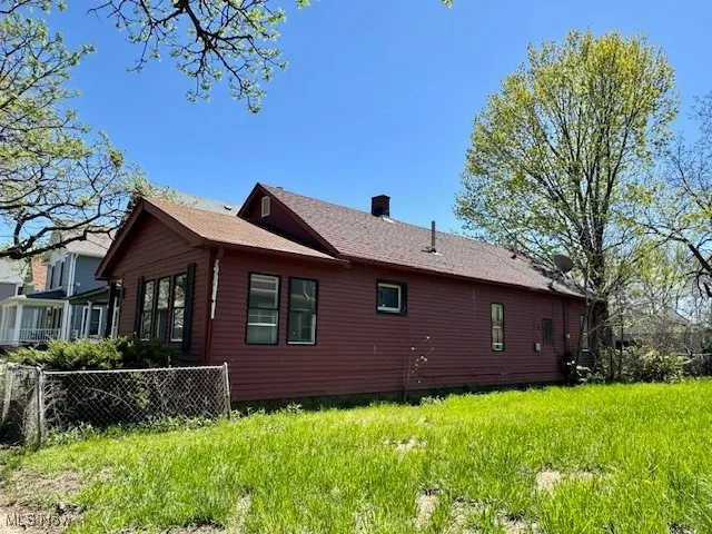 View of home's exterior with a chimney