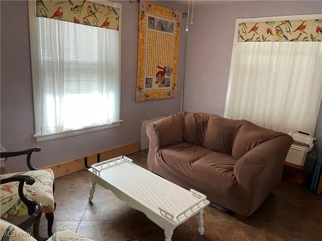 Tiled living area with baseboards