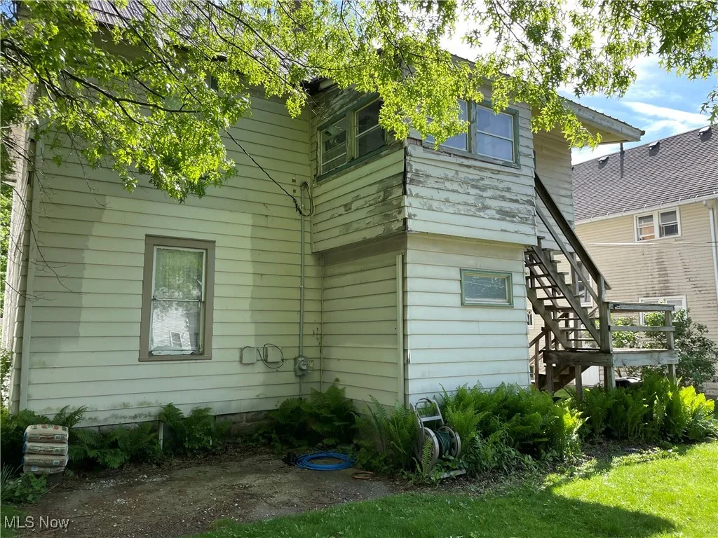 Back of house with stairs