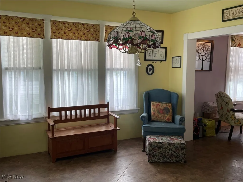 Living area featuring plenty of natural light and tile patterned floors