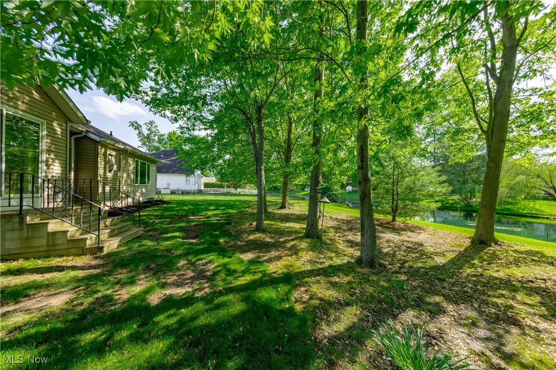 View of grassy yard featuring a water view