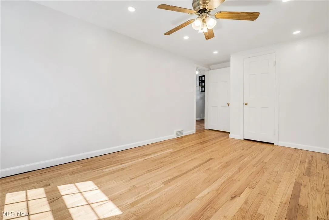 Unfurnished bedroom featuring light wood finished floors, baseboards, recessed lighting, and ceiling fan