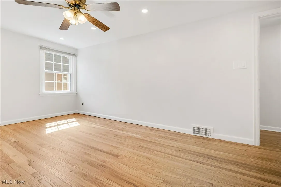 Unfurnished room with baseboards, light wood finished floors, recessed lighting, and a ceiling fan