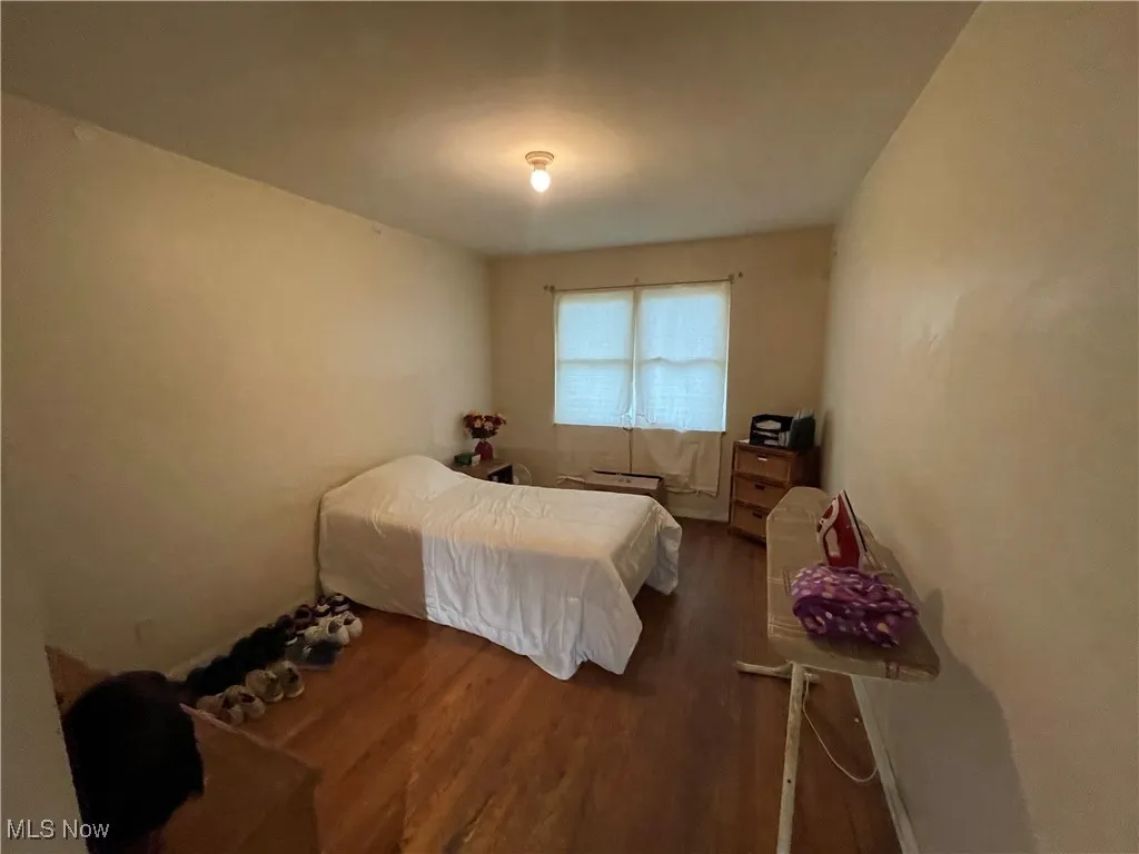 Bedroom featuring dark wood finished floors