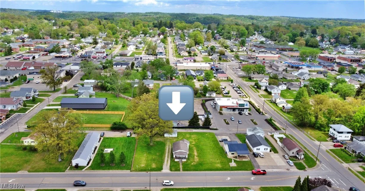 Aerial overview of property's location with nearby suburban area