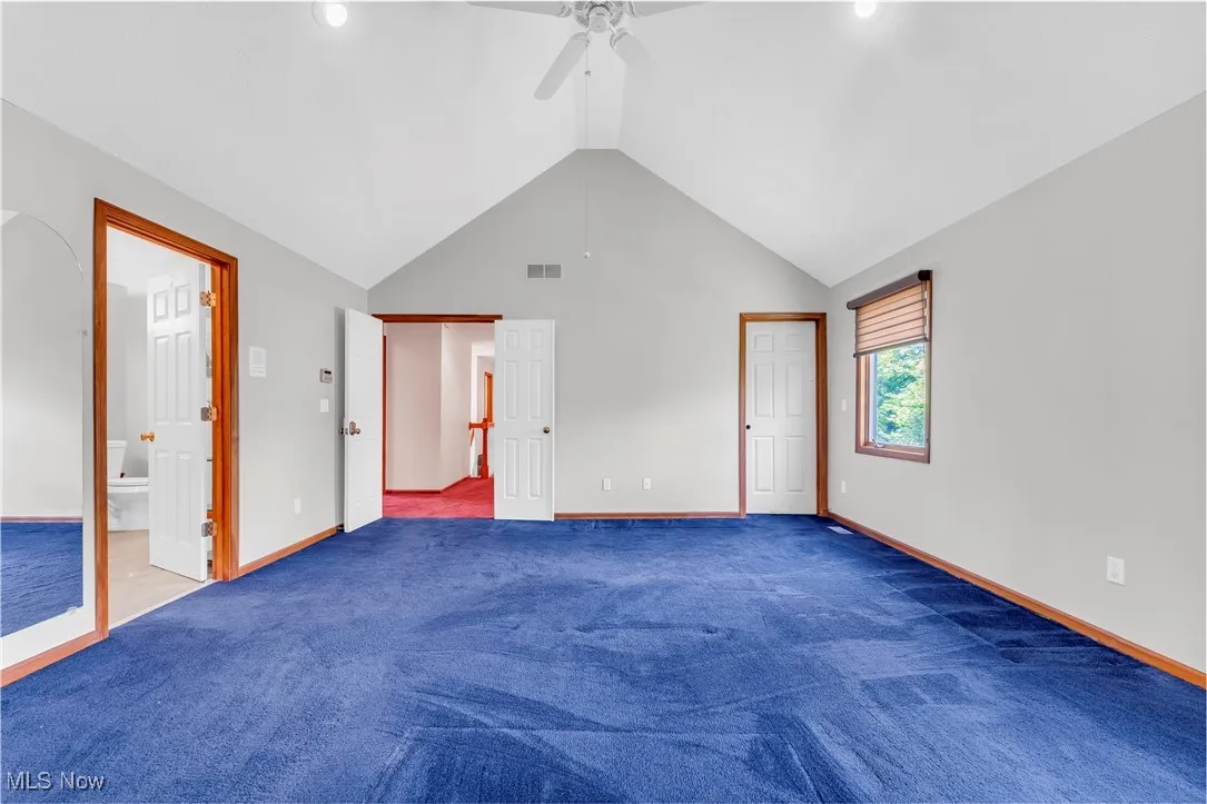 Unfurnished bedroom with baseboards, carpet flooring, ensuite bath, ceiling fan, and recessed lighting