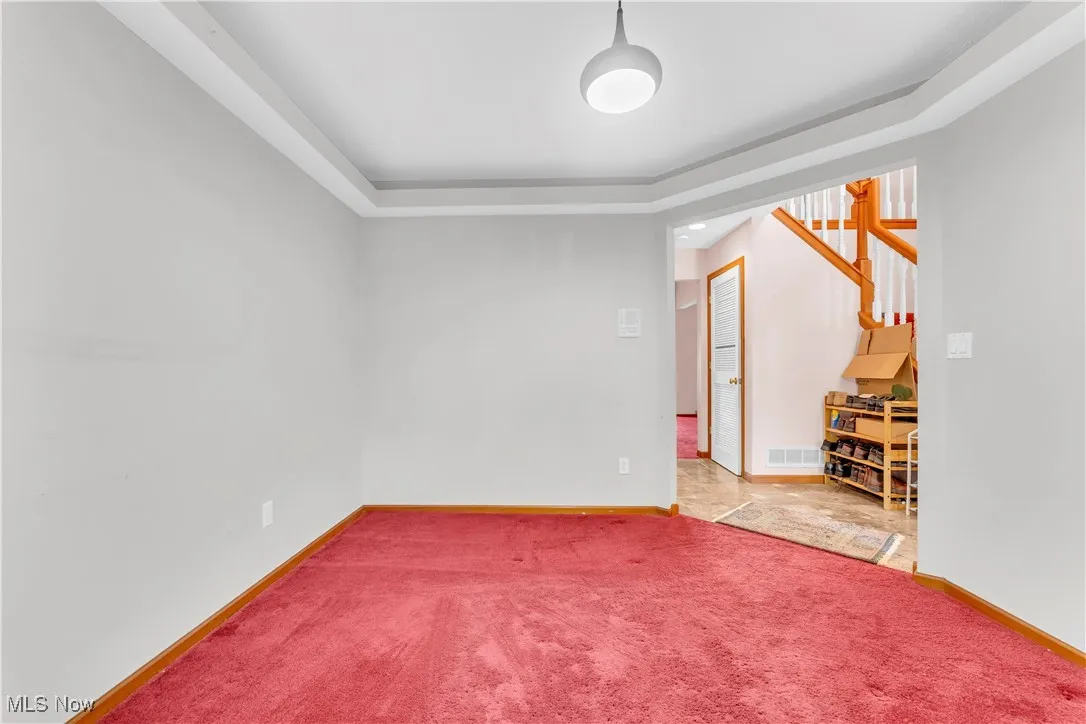 Spare room with carpet floors and baseboards