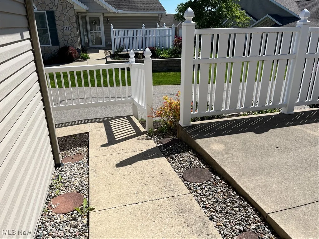 View of patio featuring a fenced front yard