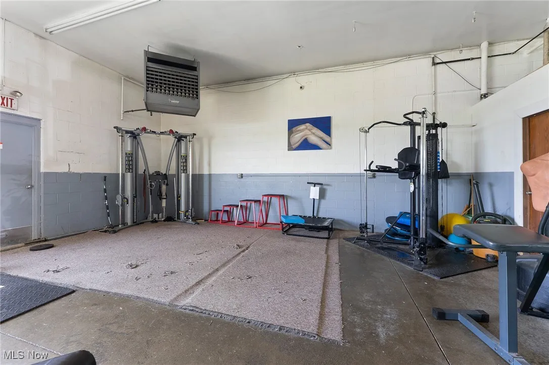 Garage featuring a heating unit