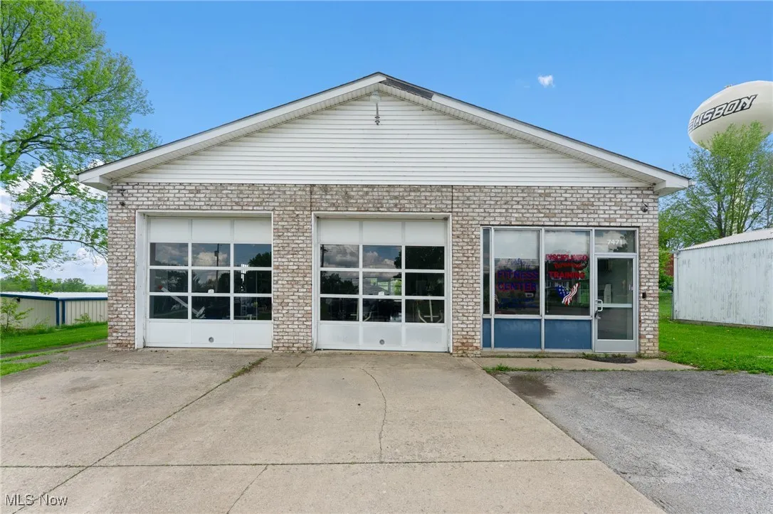 Front view of property with brick siding