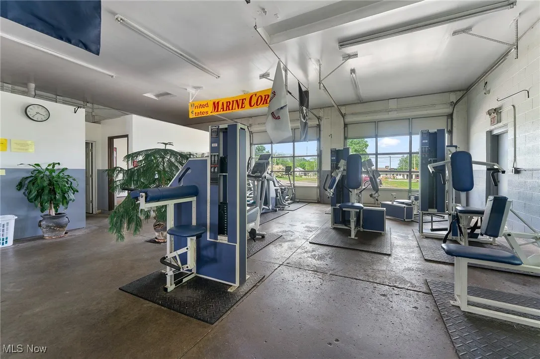 Gym with a garage and concrete block wall