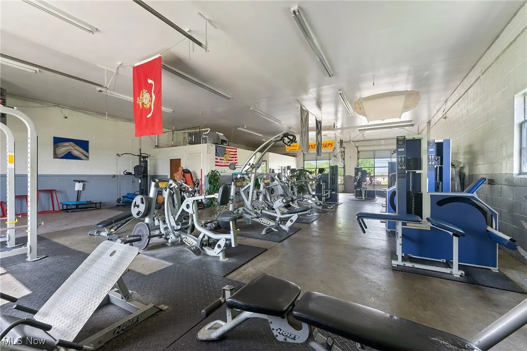 Gym featuring concrete block wall