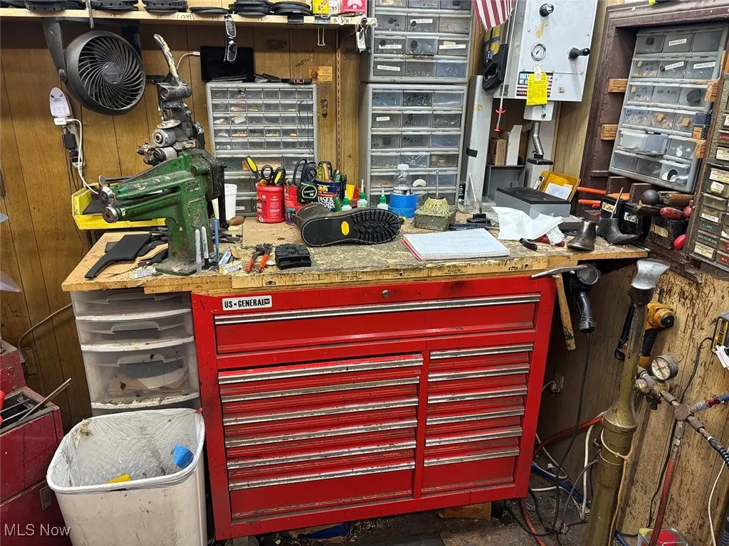 Misc room with a workshop area