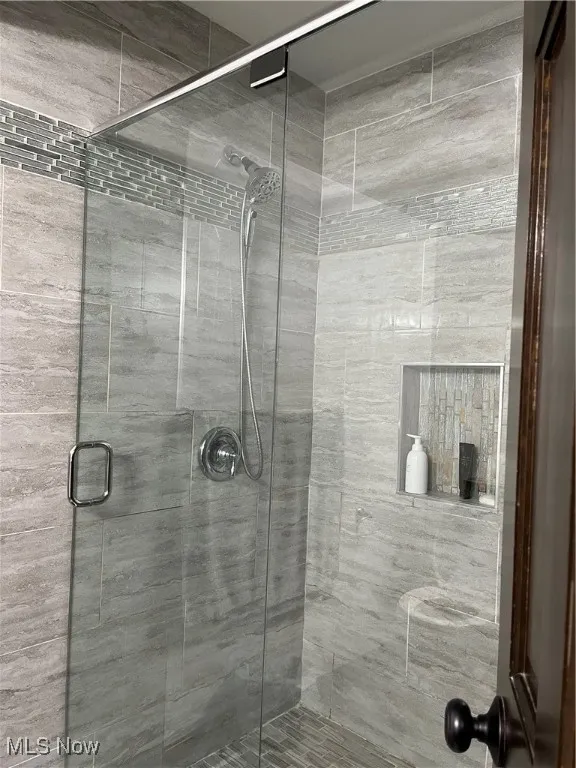 Full bathroom with a stall shower