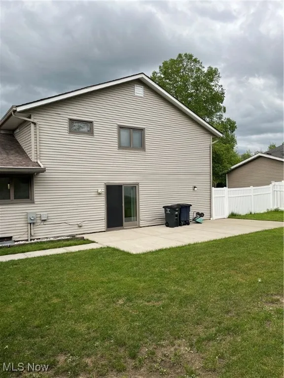 Rear view of property featuring a patio