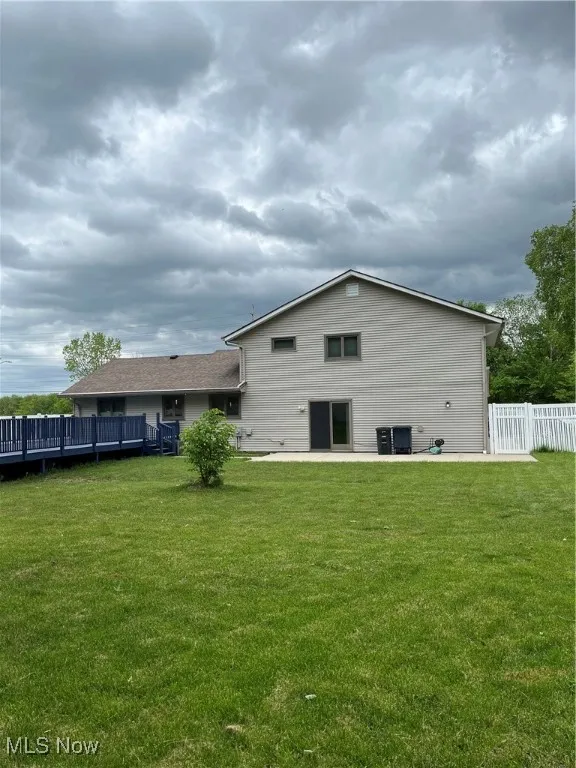 Rear view of house featuring a patio area