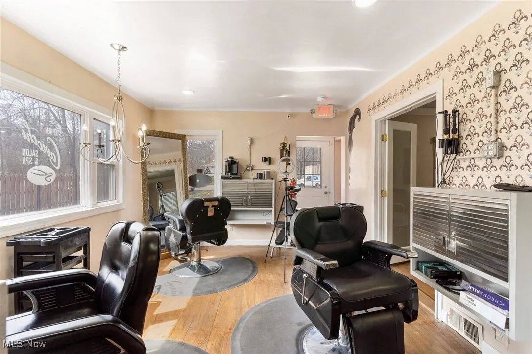 Living area featuring wood finished floors and recessed lighting