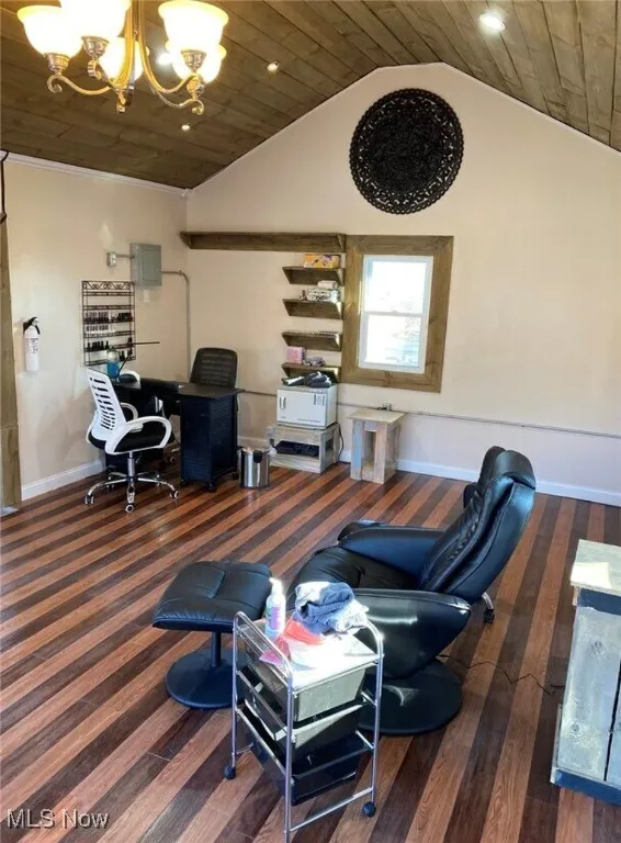 Home office featuring a chandelier, wooden ceiling, lofted ceiling, wood finished floors, and baseboards
