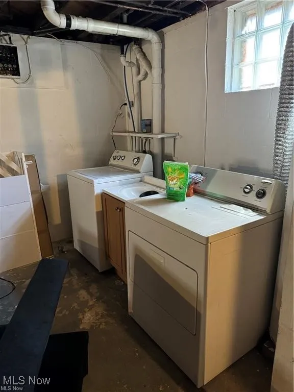 Laundry area with washer and dryer and cabinet space