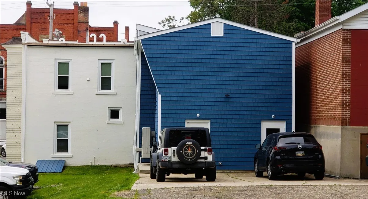 Rear entrance of retail space & upstairs apartment