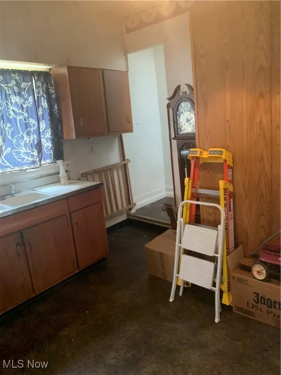 Kitchen with a sink and light countertops