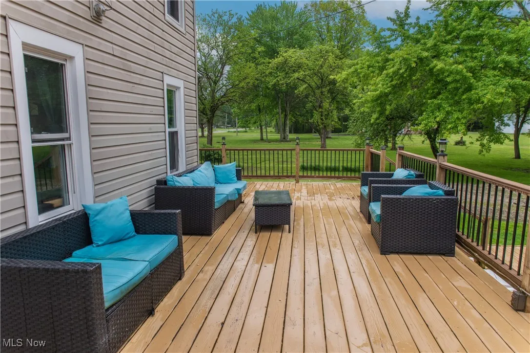 Wooden deck featuring a yard and outdoor lounge area