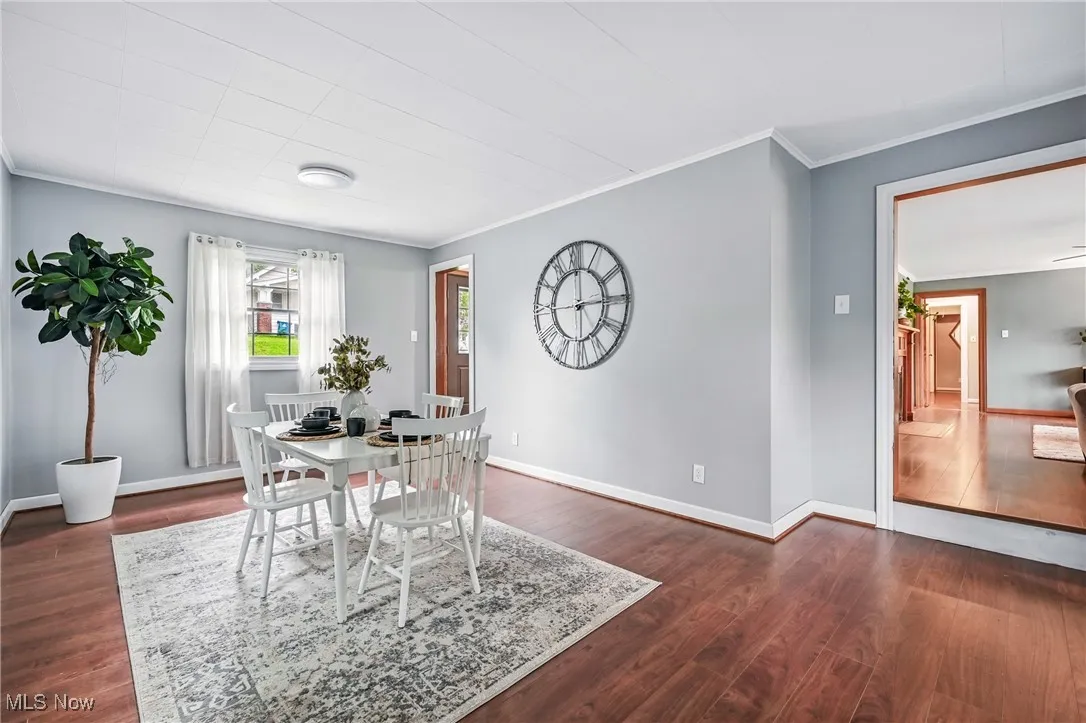 Dining area with double doors opening to secluded patio area