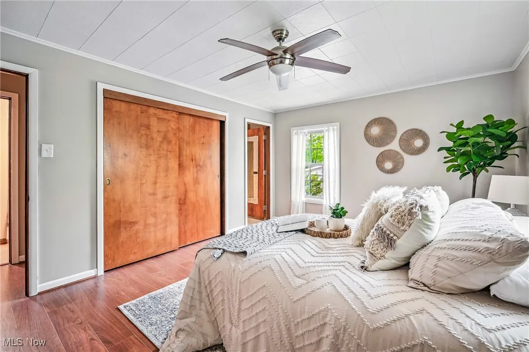 Primary Bedroom with large closet and fan