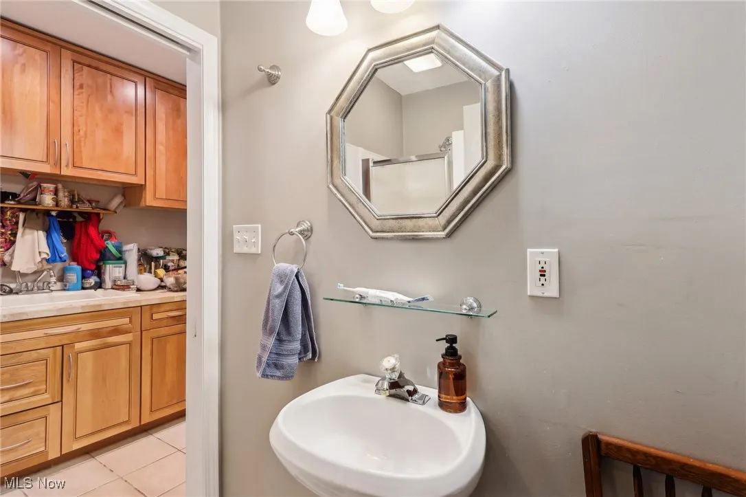Bathroom with a sink and tile patterned floors