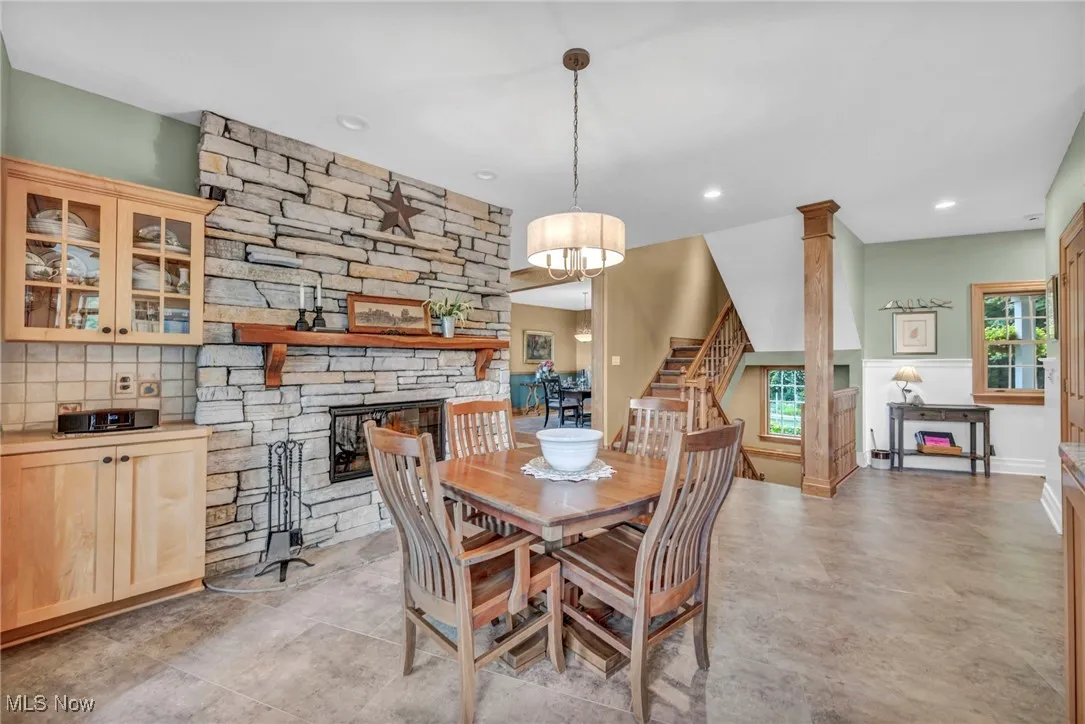 Dining space with stairs and recessed lighting