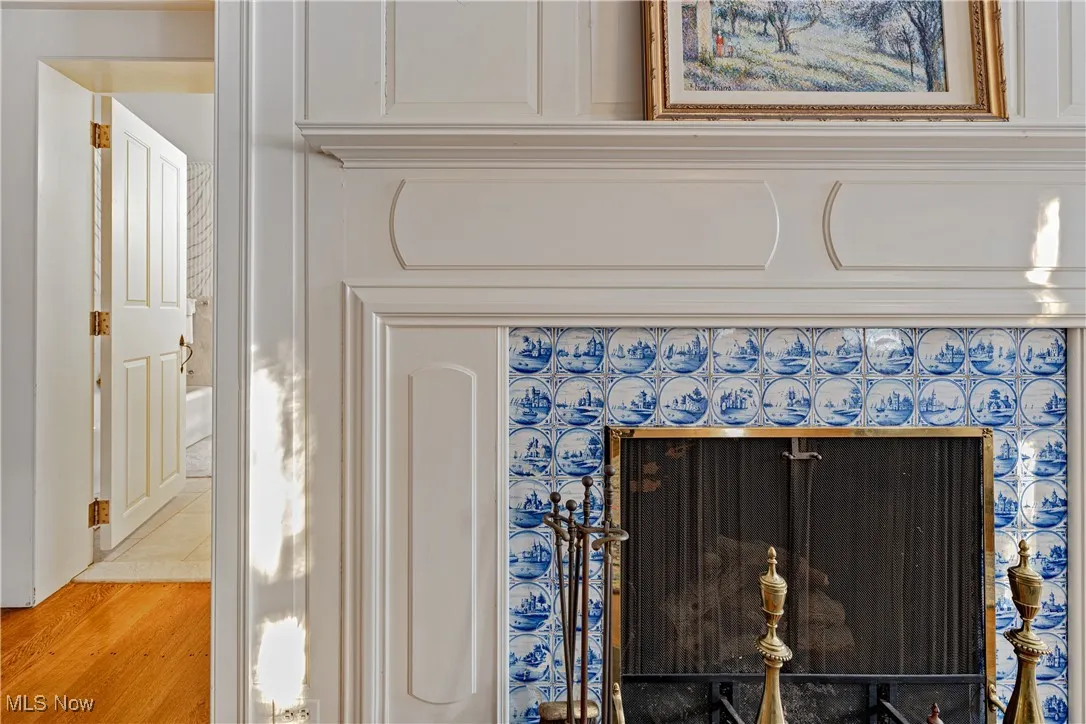 Interior details featuring light wood-type flooring and a fireplace