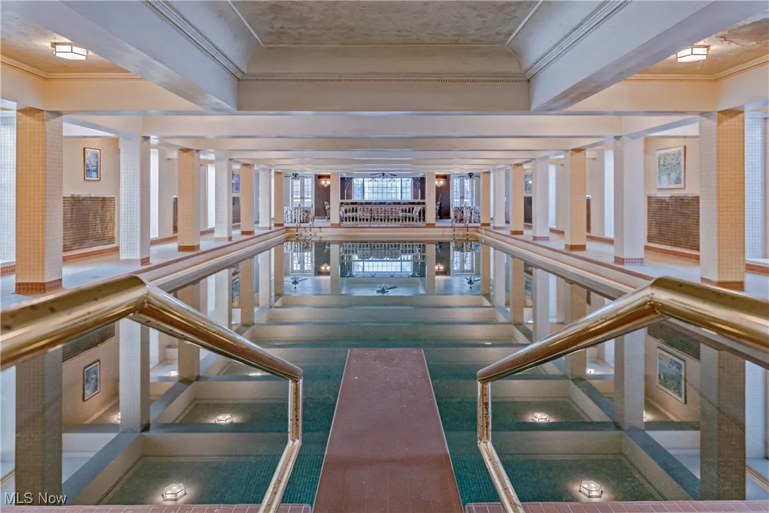 View of pool with decorative columns