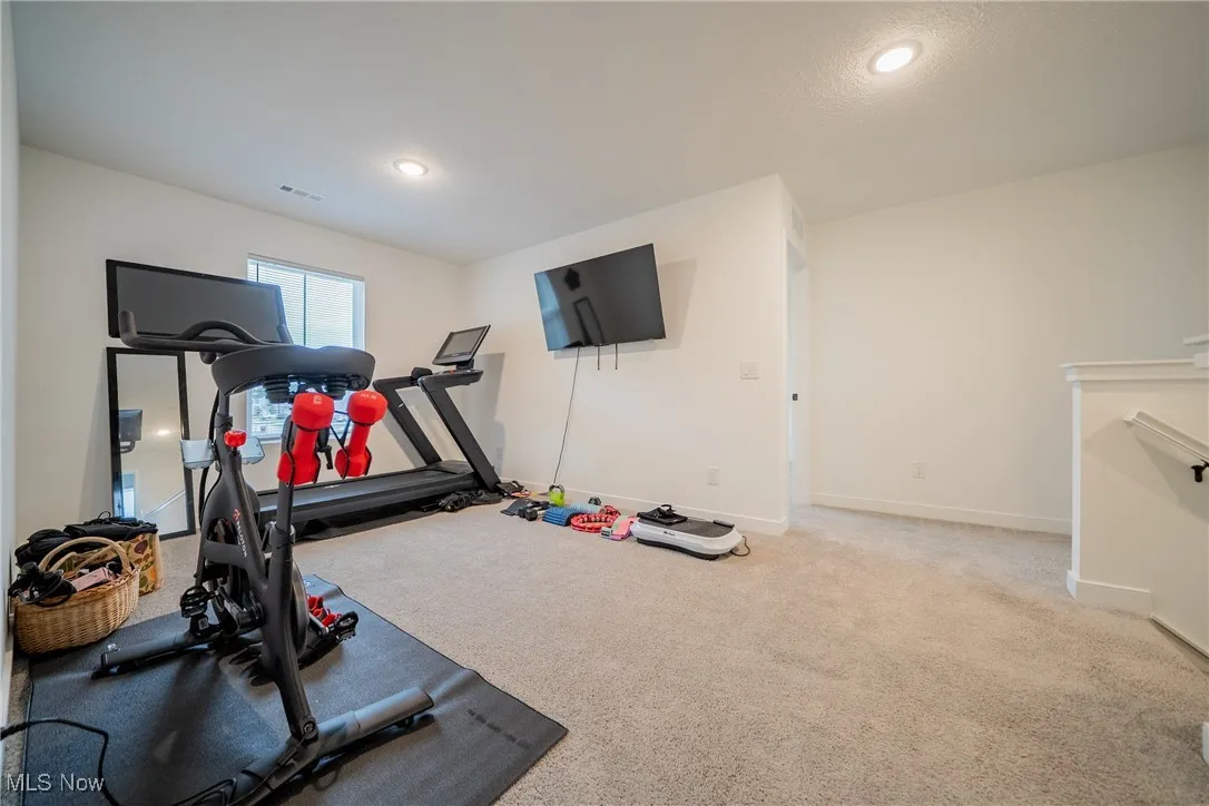 Workout area with baseboards, carpet, and recessed lighting