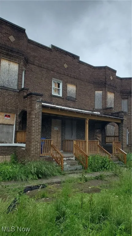 View of front of house featuring brick siding